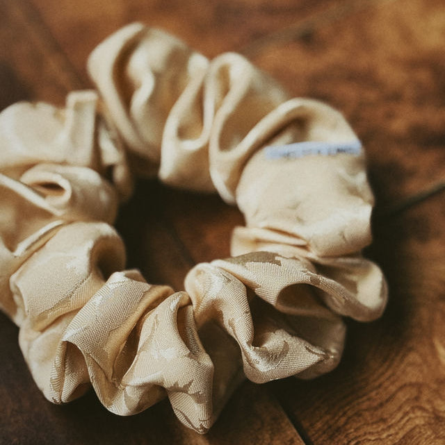 floral meadow scrunchies on a wooden surface