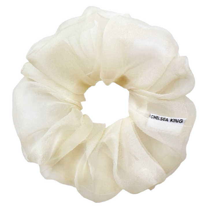 White scrunchie with 'Chelsea King' label on a white background