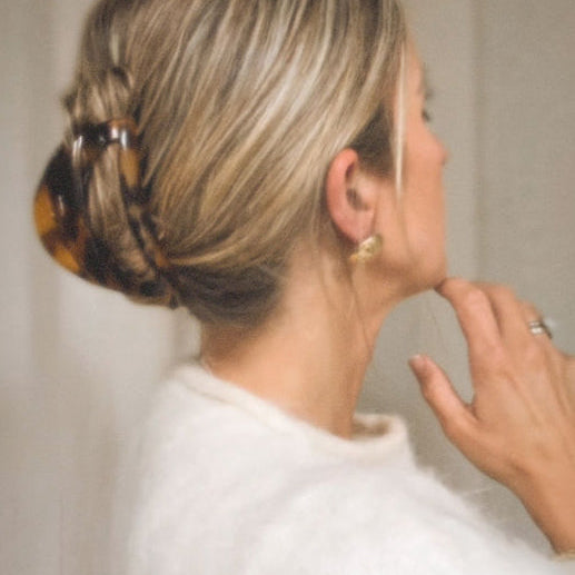 tortoise french claw in woman's hair
